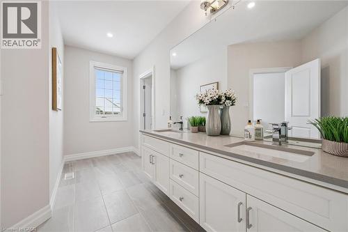Full bath with double vanity, recessed lighting, and light tile patterned floors - 263 Chestnut Ridge, Waterloo, ON - Indoor Photo Showing Bathroom