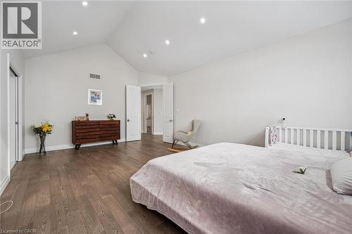 Bedroom featuring dark wood-style flooring and high vaulted ceiling - 263 Chestnut Ridge, Waterloo, ON - Indoor Photo Showing Bedroom