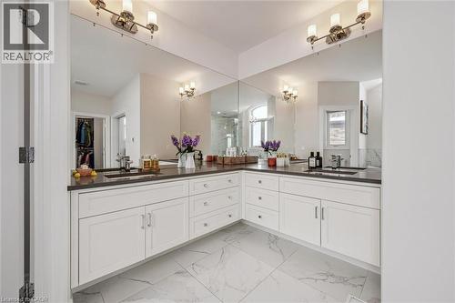 Bathroom featuring double vanity, light marble finish flooring, and a walk in closet - 263 Chestnut Ridge, Waterloo, ON - Indoor Photo Showing Bathroom