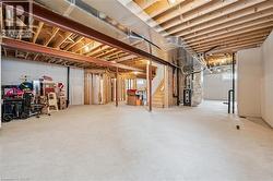 Basement with heating unit and stairway - 