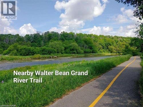 View of asphalt street with a forest view and a water view - 263 Chestnut Ridge, Waterloo, ON - Outdoor With View