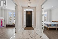 Foyer entrance with plenty of natural light, recessed lighting, and crown molding - 