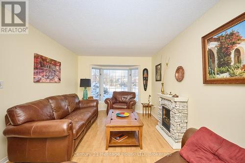 Bright and airy living room - 3722 Sussex Lane, Fort Erie (Black Creek), ON - Indoor Photo Showing Living Room With Fireplace