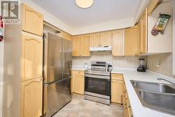 Spacious eat-in kitchen with stainless appliances - 