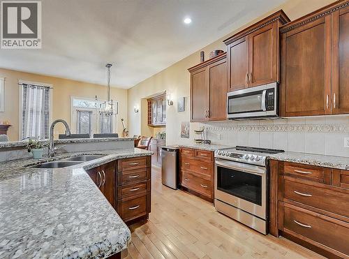 308 Lineham Acres Drive Nw, High River, AB - Indoor Photo Showing Kitchen With Double Sink
