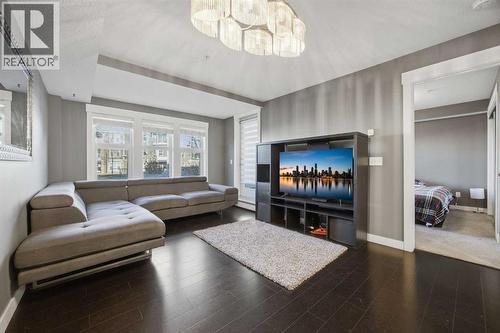 Living room and patio access - 2118, 11 Mahogany Row Se, Calgary, AB - Indoor Photo Showing Living Room