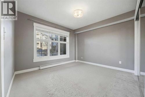 Primary bedroom unfurnished - 2118, 11 Mahogany Row Se, Calgary, AB - Indoor Photo Showing Other Room