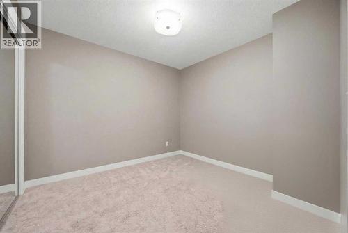 Second room unfurnished - 2118, 11 Mahogany Row Se, Calgary, AB - Indoor Photo Showing Other Room