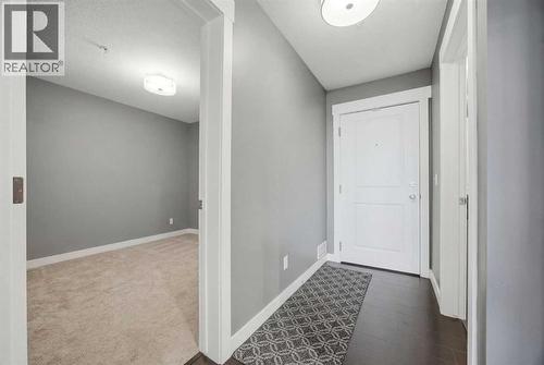 Entrance and second bedroom/office - 2118, 11 Mahogany Row Se, Calgary, AB - Indoor Photo Showing Other Room