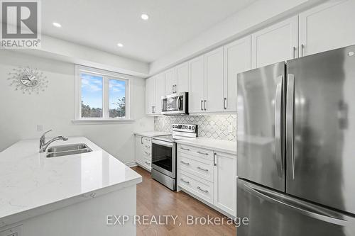 22 18Th Street N, Wasaga Beach, ON - Indoor Photo Showing Kitchen With Double Sink With Upgraded Kitchen