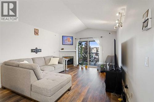 510, 55 Arbour Grove Close Nw, Calgary, AB - Indoor Photo Showing Living Room With Fireplace