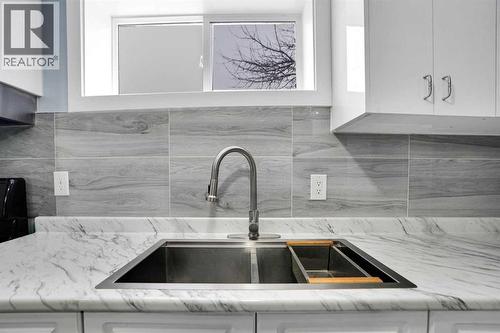200 Penbrooke Close Se, Calgary, AB - Indoor Photo Showing Kitchen With Double Sink