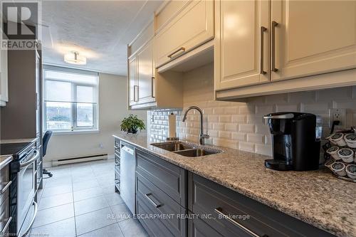 Kitchen with appliances w/stainless steel finishes - 402 - 40 Harrisford Street, Hamilton, ON - Indoor Photo Showing Kitchen With Double Sink With Upgraded Kitchen