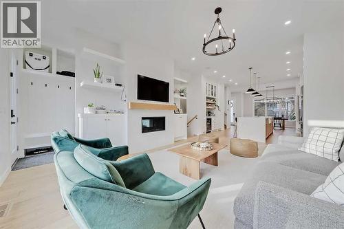 619 55 Avenue Sw, Calgary, AB - Indoor Photo Showing Living Room With Fireplace