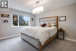 Spacious primary bedroom with walk-in closet and great natural light. - 