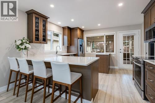 Updated kitchen featuring refreshed cabinetry, counters, and modern appliances. - 1255 Raymer Avenue Unit# 507, Kelowna, BC - Indoor