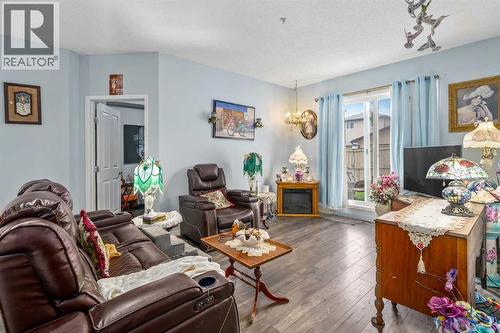 1116, 1140 Taradale Drive Ne, Calgary, AB - Indoor Photo Showing Living Room