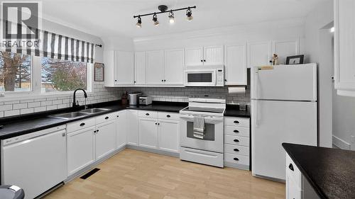 5813 50 Street, Taber, AB - Indoor Photo Showing Kitchen With Double Sink