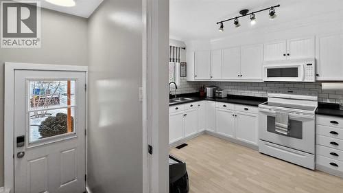 5813 50 Street, Taber, AB - Indoor Photo Showing Kitchen With Double Sink