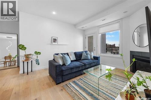 602 2055 Rose Street, Regina, SK - Indoor Photo Showing Living Room With Fireplace