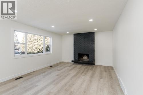 7790 Queens Crescent, Prince George, BC - Indoor With Fireplace