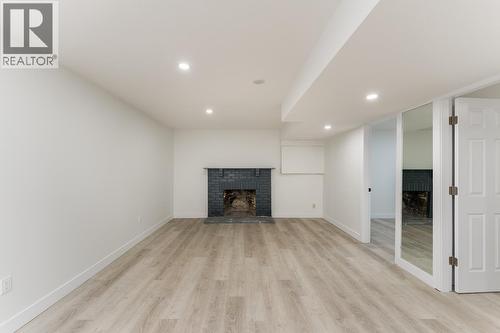 7790 Queens Crescent, Prince George, BC - Indoor Photo Showing Living Room With Fireplace
