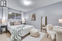 Spacious secondary bedroom ideal for family, guests, or a home office. - 