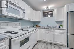 Convenient secondary kitchen area for suite functionality. - 