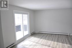 Unit 2 Livingroom with Balcony - 