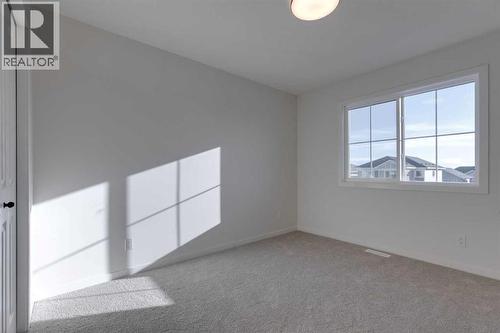1379 Bayview Crescent Sw, Airdrie, AB - Indoor Photo Showing Other Room