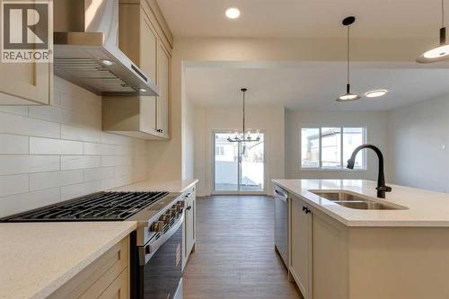 1379 Bayview Crescent Sw, Airdrie, AB - Indoor Photo Showing Kitchen With Double Sink With Upgraded Kitchen