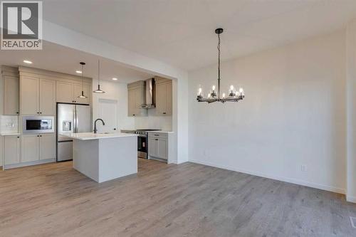 1379 Bayview Crescent Sw, Airdrie, AB - Indoor Photo Showing Kitchen With Upgraded Kitchen