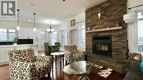 8245 102 Avenue, Peace River, AB - Indoor Photo Showing Living Room With Fireplace