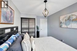 Bedroom featuring a textured ceiling - 