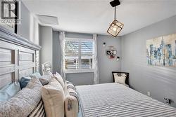 Bedroom featuring a textured ceiling - 