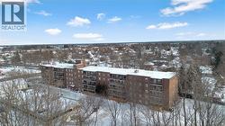 Snowy aerial view with a view of apartment building / complex - 