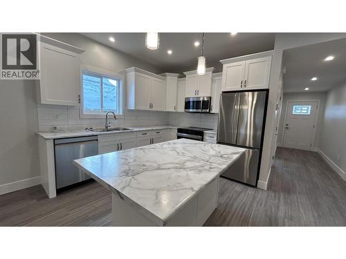 13 105 Forest Ridge Road, 100 Mile House, BC - Indoor Photo Showing Kitchen With Double Sink With Upgraded Kitchen