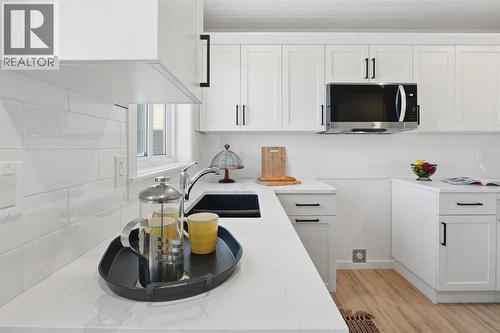 6 Metcalf Way, Lacombe, AB - Indoor Photo Showing Kitchen With Double Sink