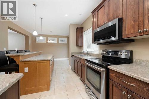 Kitchen with view of diningroom - 197 Snowy Owl Way Nw, Fort Mcmurray, AB - Indoor Photo Showing Kitchen With Double Sink