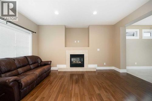Living room with gas fireplace - 197 Snowy Owl Way Nw, Fort Mcmurray, AB - Indoor Photo Showing Living Room With Fireplace