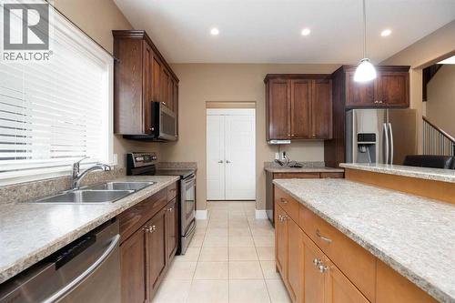 Kitchen with SS apliances - 197 Snowy Owl Way Nw, Fort Mcmurray, AB - Indoor Photo Showing Kitchen With Double Sink