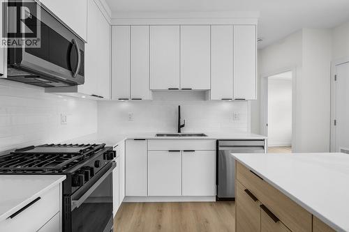 Photos may be of a similar home in the community - 5300 Main Street Unit# 202, Kelowna, BC - Indoor Photo Showing Kitchen With Stainless Steel Kitchen With Upgraded Kitchen