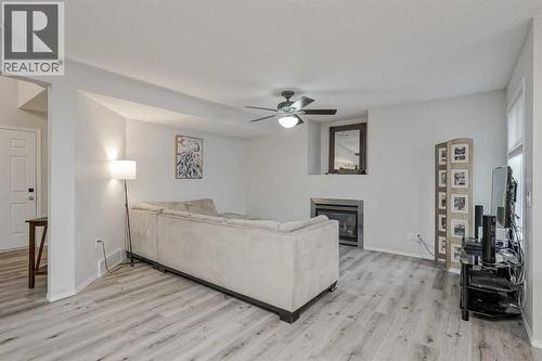 222 Bridleridge Way Sw, Calgary, AB - Indoor With Fireplace