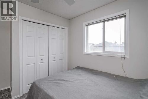 222 Bridleridge Way Sw, Calgary, AB - Indoor Photo Showing Bedroom