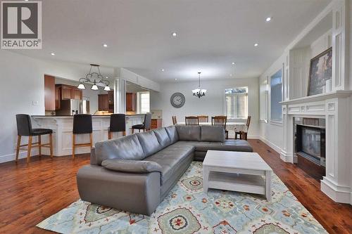 213 E 350 S, Raymond, AB - Indoor Photo Showing Living Room With Fireplace