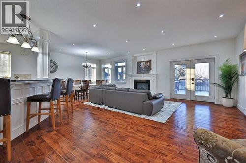 213 E 350 S, Raymond, AB - Indoor Photo Showing Living Room With Fireplace