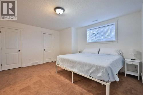 213 E 350 S, Raymond, AB - Indoor Photo Showing Bedroom