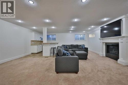 213 E 350 S, Raymond, AB - Indoor Photo Showing Other Room With Fireplace