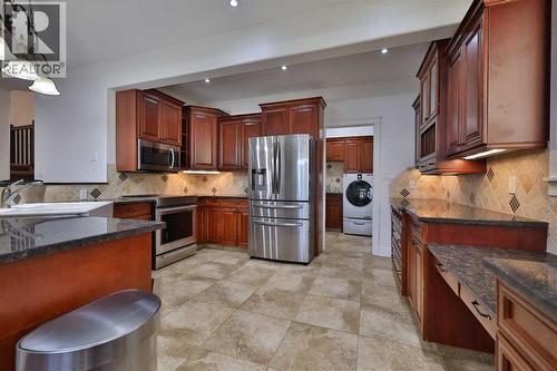 213 E 350 S, Raymond, AB - Indoor Photo Showing Kitchen With Stainless Steel Kitchen