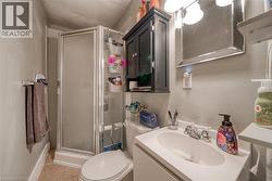 Full bathroom with a shower stall and vanity - 